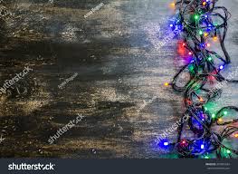 Christmas Lights On Dark Rustic Background Stock Photo Edit