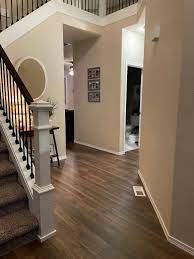 high ceiling hallway design with brown