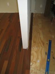 laying hardwoods around a wall or