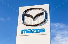 official dealership sign mazda against