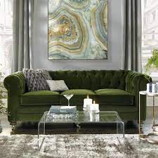 Lush Green Sofa With Two Grey Cushions