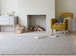 pebble floor rug in natural hand