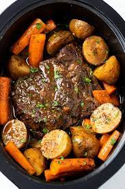 A Crock Pot Roast In A Slow Cooker With Potatoes And Carrots With Gravy  gambar png