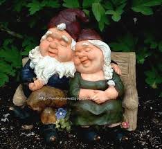 mr mrs gnome sitting on bench garden