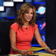 suzy kolber by the football