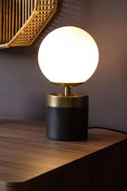 white glass globe table lamp with black