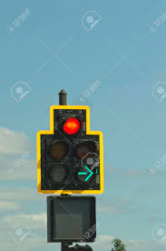 Traffic Signal With Red Light And A Green Directional Arrow