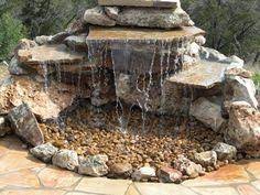 There is nothing quite as calming and tranquil like the sound of water in a garden. Directions For Installing A Pondless Waterfall Without Buying An Expensive Kit Hunker Backyard Water Feature Waterfalls Backyard Diy Garden Fountains