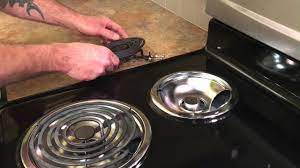 clean underneath stove top