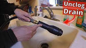 unclog drain with drain cleaning