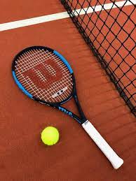 tennis racquet on clay court tennis