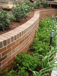 Curved Brick Walls With Planting To