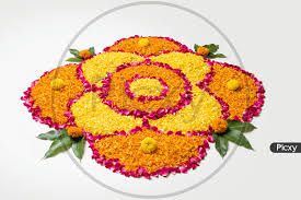 image of flower rangoli with diya for