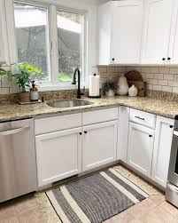 white kitchen cabinets with dark