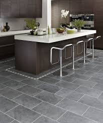 The kitchen with light grey island with dining seating features a black countertop and full kitchen sink and white cabinet. Design Ideas Marvellous Kitchen Design Ideas With Dark Charcoal Karndean Floor Tiles Along With Grey Kitchen Floor Kitchen Flooring Modern Kitchen Flooring