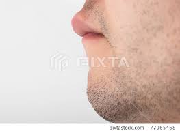 a man has a large upper lip close up
