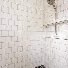 dark gray grout on white square tiles