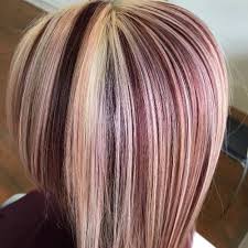 We cherish the smooth layers that flaunt the blonde flawlessness of this pixie cut. Burgundy Highlights On Short Blonde Hair Burgundy Blonde Hair Blonde Hair With Highlights Brown Hair With Blonde Highlights