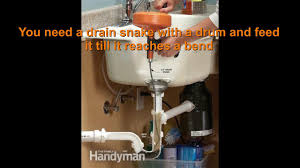how to use drain snake clogged kitchen