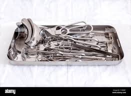 Gynecological sterile tools. A lot of instruments of gynecologist on white  background. Top view Stock Photo - Alamy