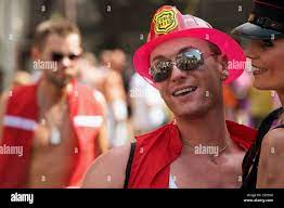 Gay man dressed as a fireman at the annual Christopher Street Day parade,  Cologne, Germany Stock Photo 