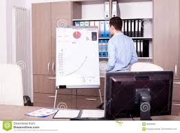 Young Businessman Next To A Flip Chart Stock Image Image