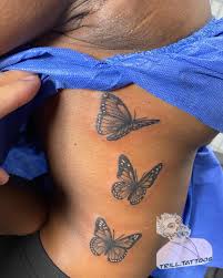 Butterfly Tattoo on Black Skin Rib
