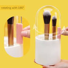 white plastic makeup brush holder