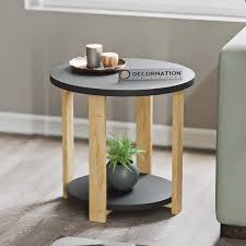 One of them is this round coffee table with glass top which has an effortless design. Juno Modern Round Mdf End Table Decornation