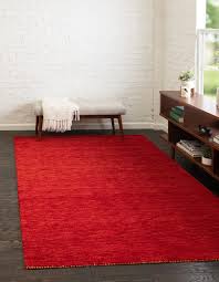 red rug and wall to wall carpeting