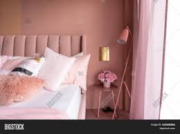 The matt grey lighting, spot bedding and rustic wood furniture create a cool contrast against the pretty pink. Cozy Pink Bedroom Image Photo Free Trial Bigstock