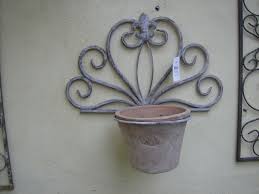 aged metal wall mounted single flower
