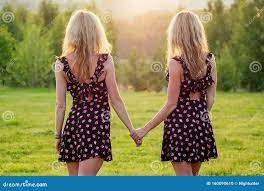Two Lesbians Sisters Twins Beautiful Curly Blonde Young Woman in Stylish  Dress Holding Hands in the Summer Park Sunset Stock Photo - Image of  friendship, hair: 160090610