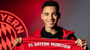 Jamal musiala (born 26 february 2003) is a british footballer who plays as a central attacking midfielder for german club fc bayern münchen. Jamal Musiala Signs New Long Term Contract With Bayern Munich Will Remain With The Club Until 2026 Reportr Door