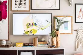 an amazing gallery wall with the frame tv