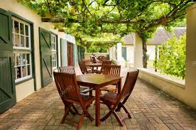 tables on terrace covered by g vine