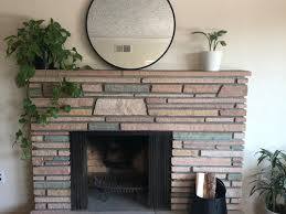 mirror above an offset fireplace