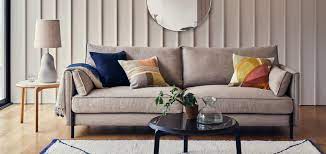 arrange cushions on a sofa