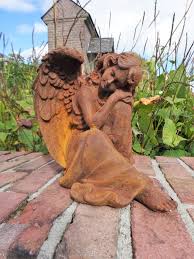 Old Garden Sculpture Of An Angel