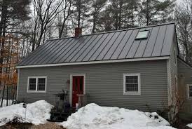 Stick with more blues or greens or even a lighter shade of gray to avoid a sharp contrast with the roof. Gray House With Metal Roof Home Exterior Makeover Metal Roof House Exterior