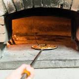 How do you clean the inside of a pizza oven?