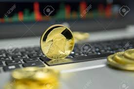 Golden Titan Bitcoin Coin With Gold Coins Lying Around On A Silver