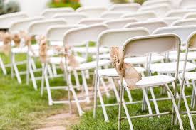 empty white chairs before wedding
