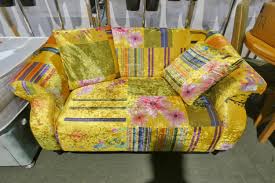 a colourful two person sofa upholstered
