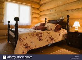 Angled View Of Antique Wooden Bed In Eastern White Wood Log