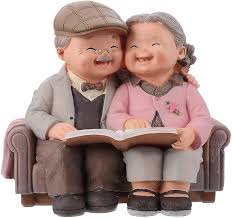 loving elderly couple figurines garden