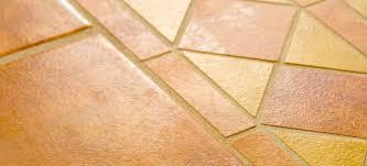 remove adhesive from ceramic tile