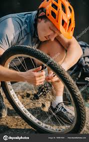 How long do bike wheel bearings last ? A young cyclist repairing bicycle wheel