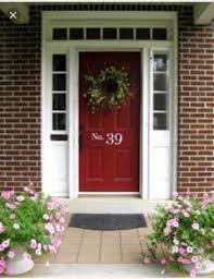 red front door on a red brick house