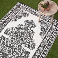 white motif design reversible outdoor rug